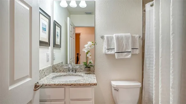 a living room with couch and a window