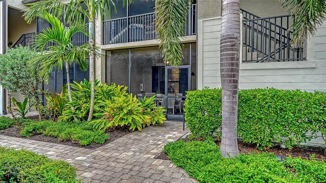 a kitchen with sink and view of living room