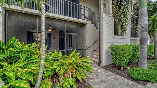a aerial view of a house with a yard table and chairs