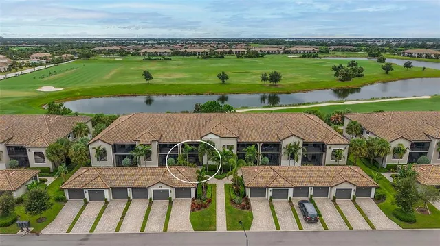 a front view of a house with swimming pool and porch