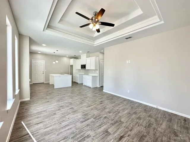 a view of a livingroom with a kitchen