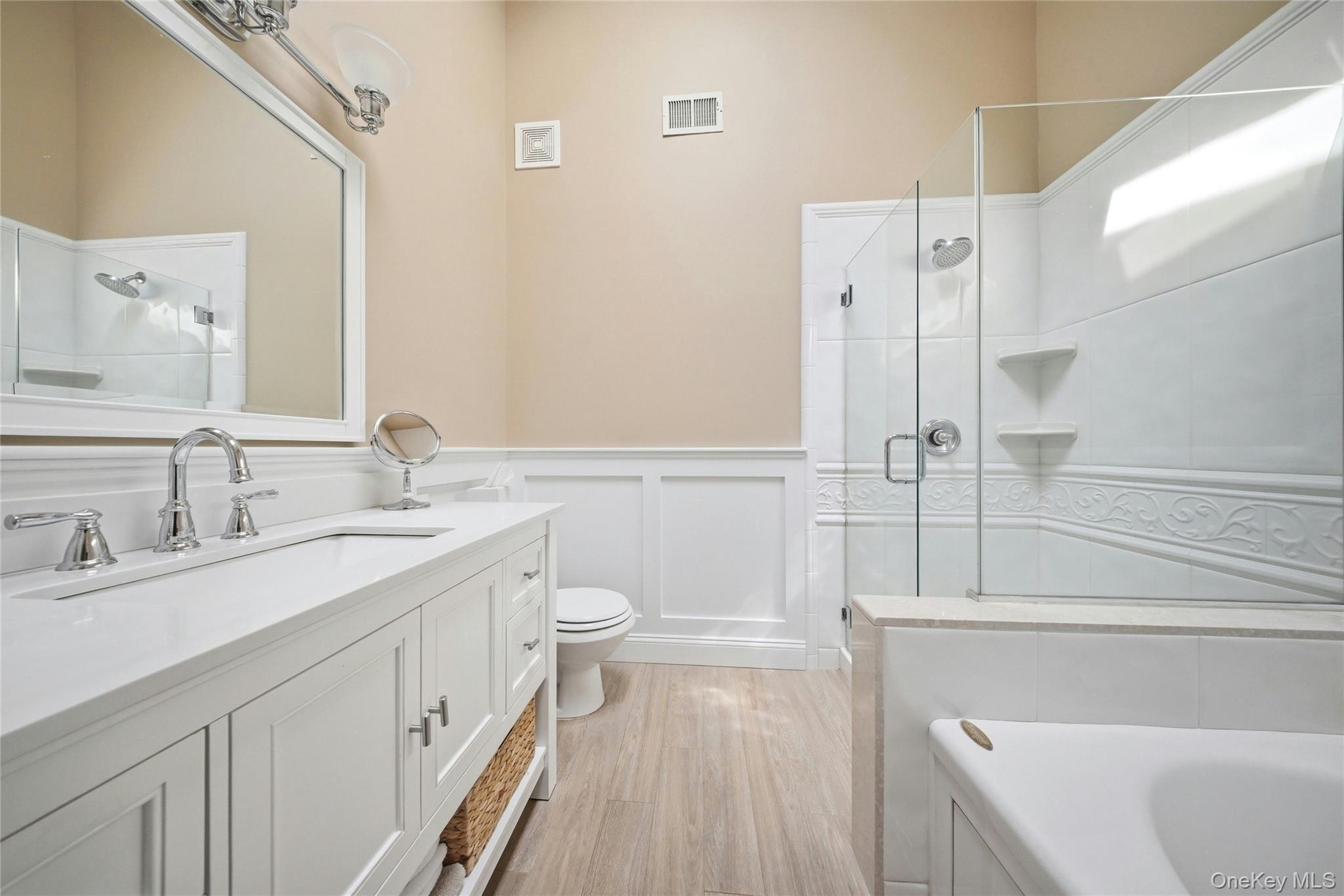 78 Hidden Ridge Drive Syosset, NY 11791 - Photo 13 of 21 a bathroom with a sink a toilet and shower