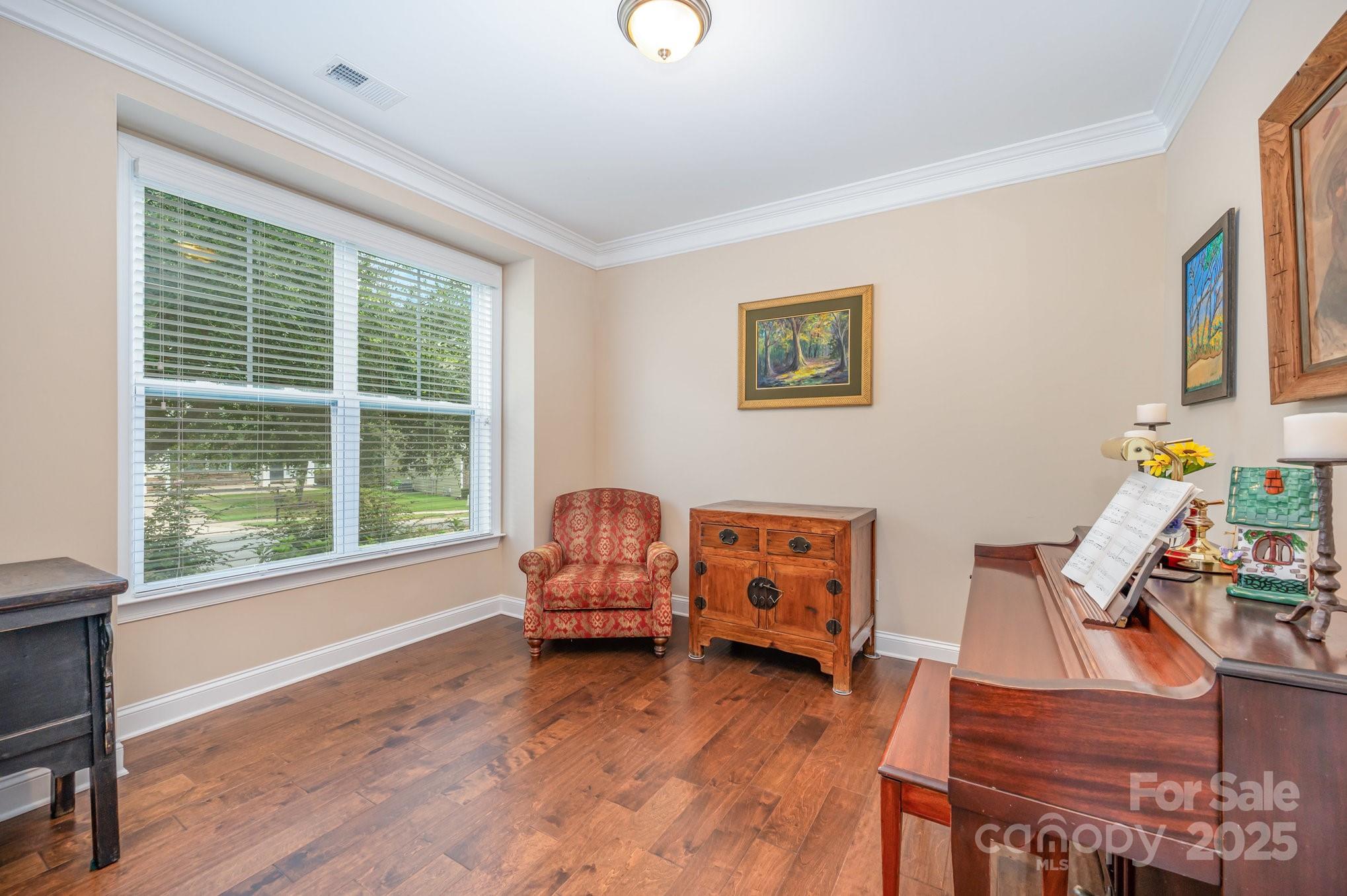 819 Coralbell Way Tega Cay, SC 29708 - Photo 12 of 33 a living room with furniture and a window