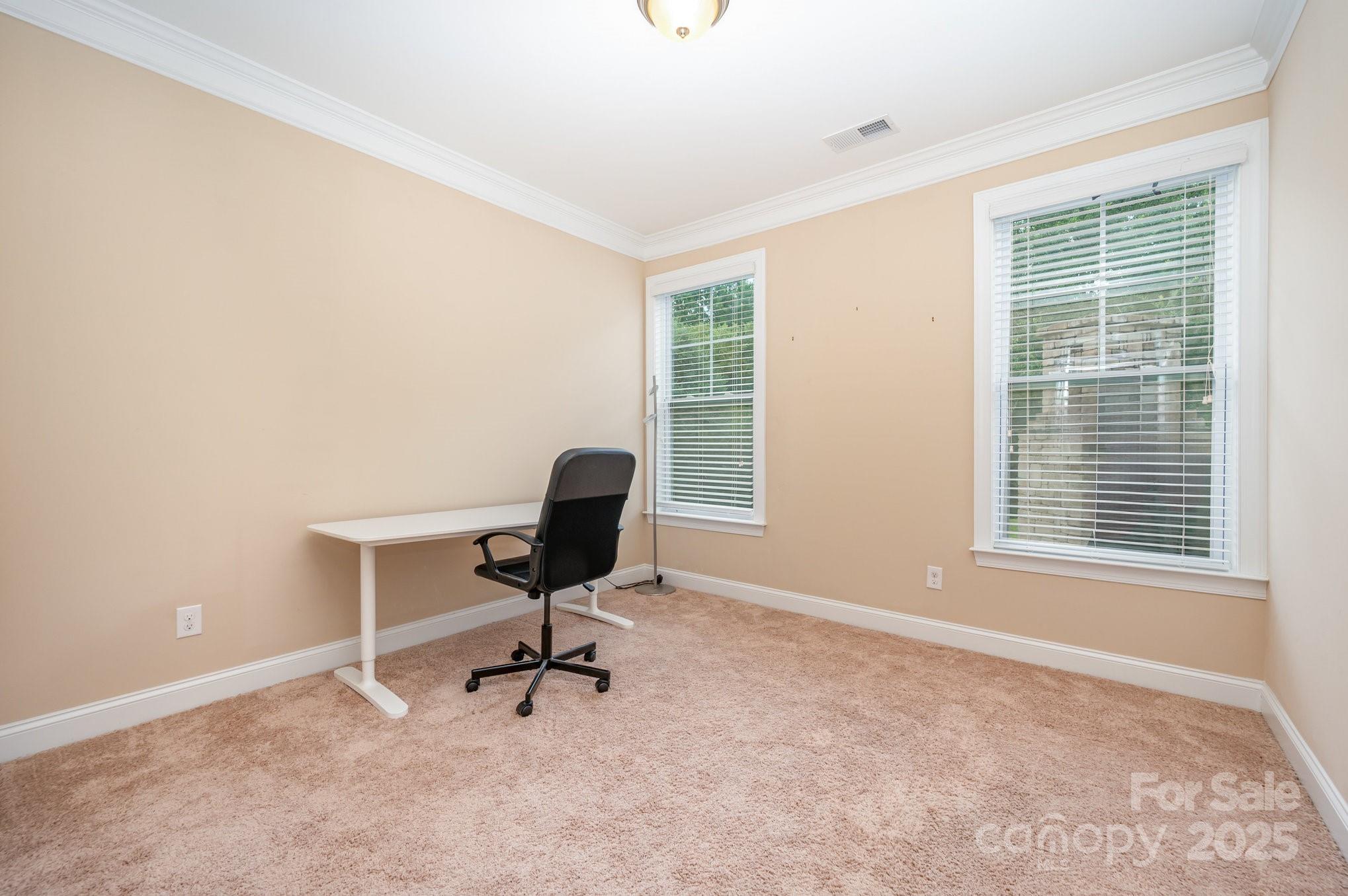 819 Coralbell Way Tega Cay, SC 29708 - Photo 14 of 33 a view of a workspace with furniture and a window
