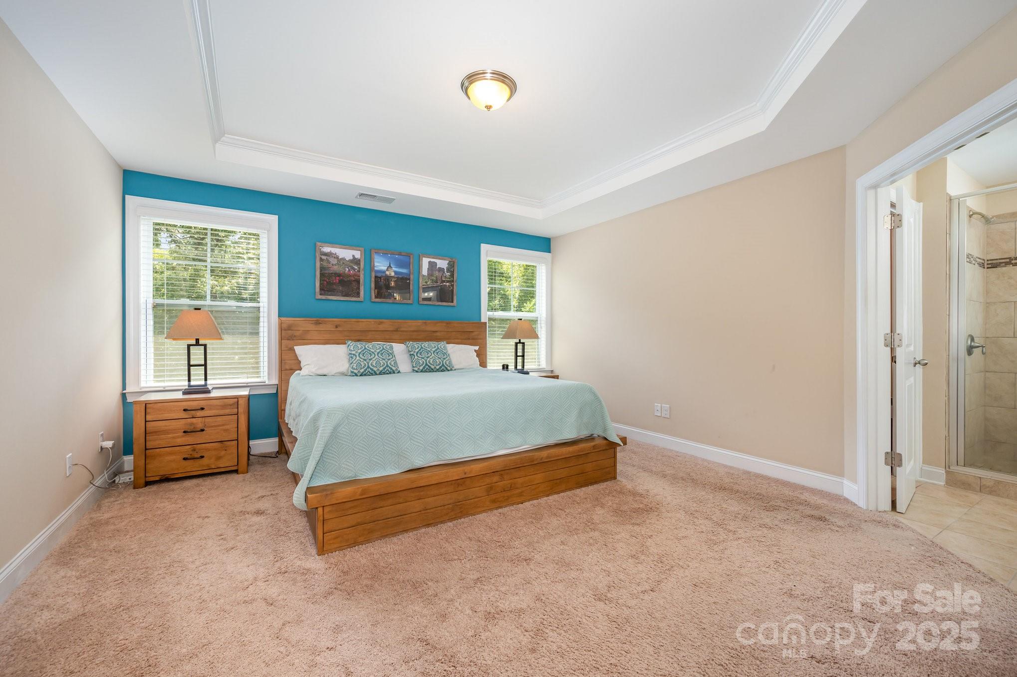 819 Coralbell Way Tega Cay, SC 29708 - Photo 15 of 33 a bedroom with a bed and a window