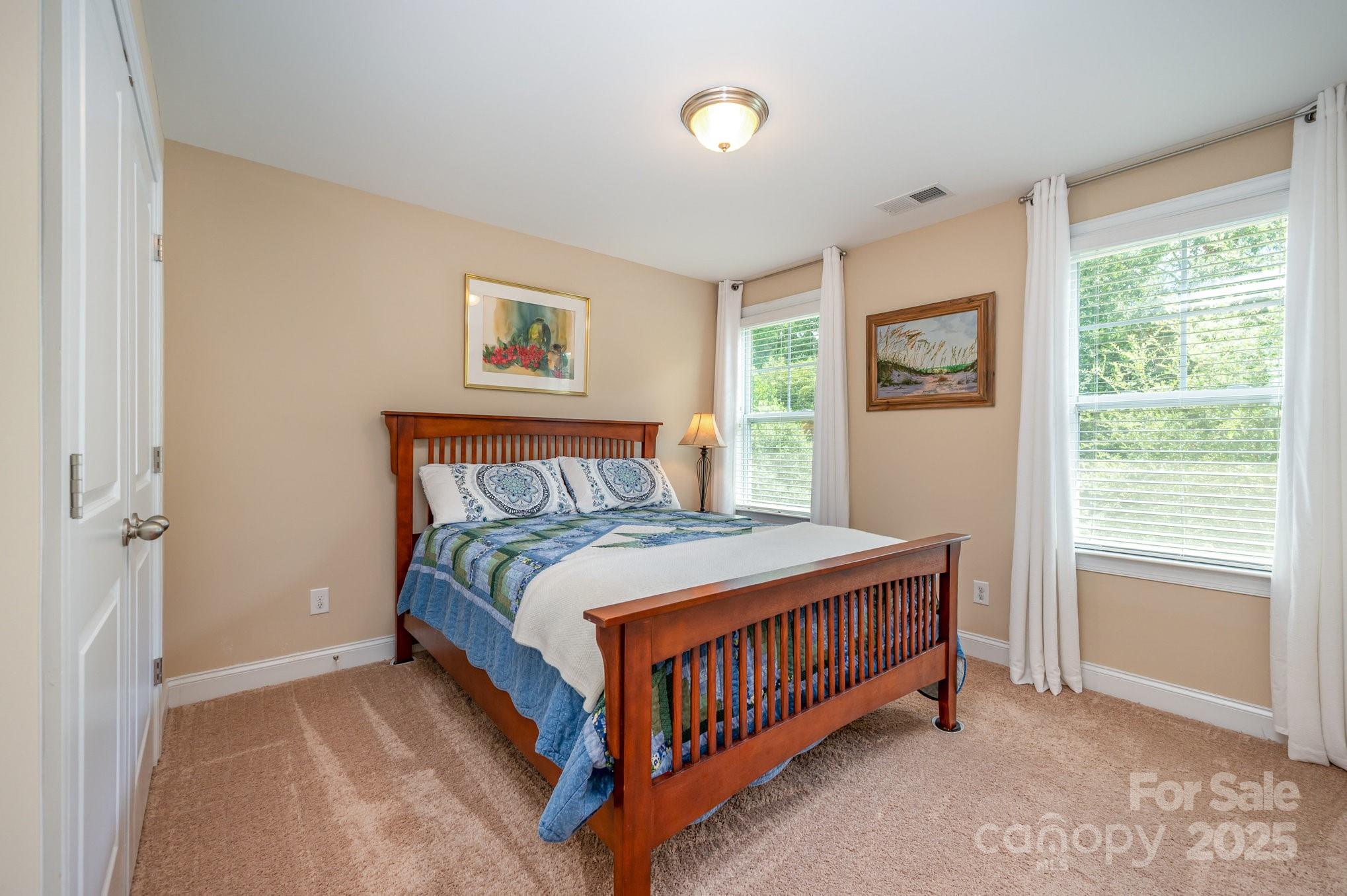 819 Coralbell Way Tega Cay, SC 29708 - Photo 19 of 33 a bedroom with a bed and a window