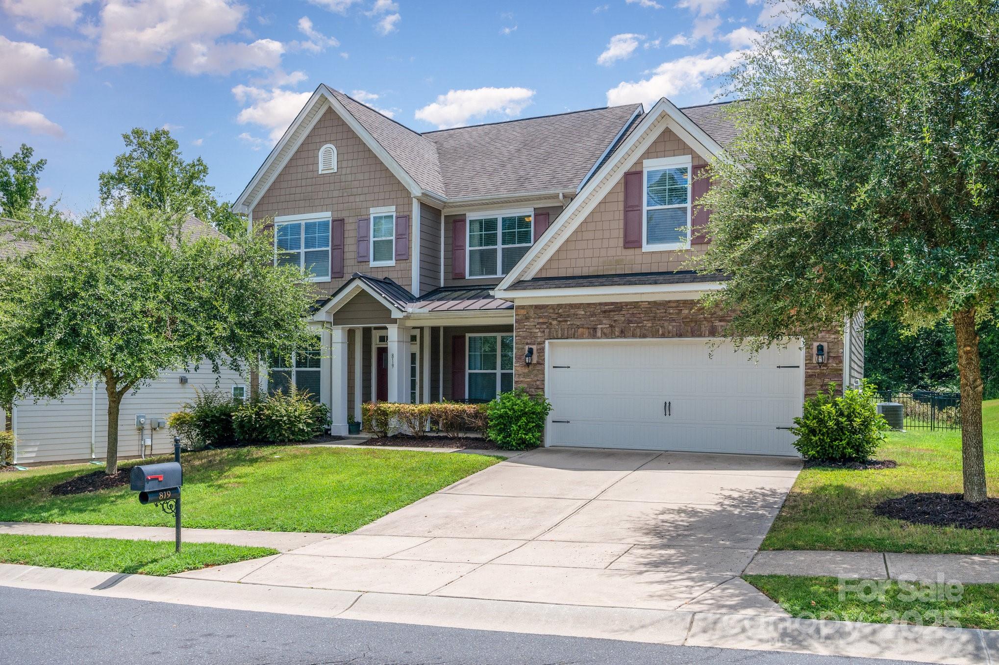 819 Coralbell Way Tega Cay, SC 29708 - Photo 2 of 33 a front view of a house with a yard