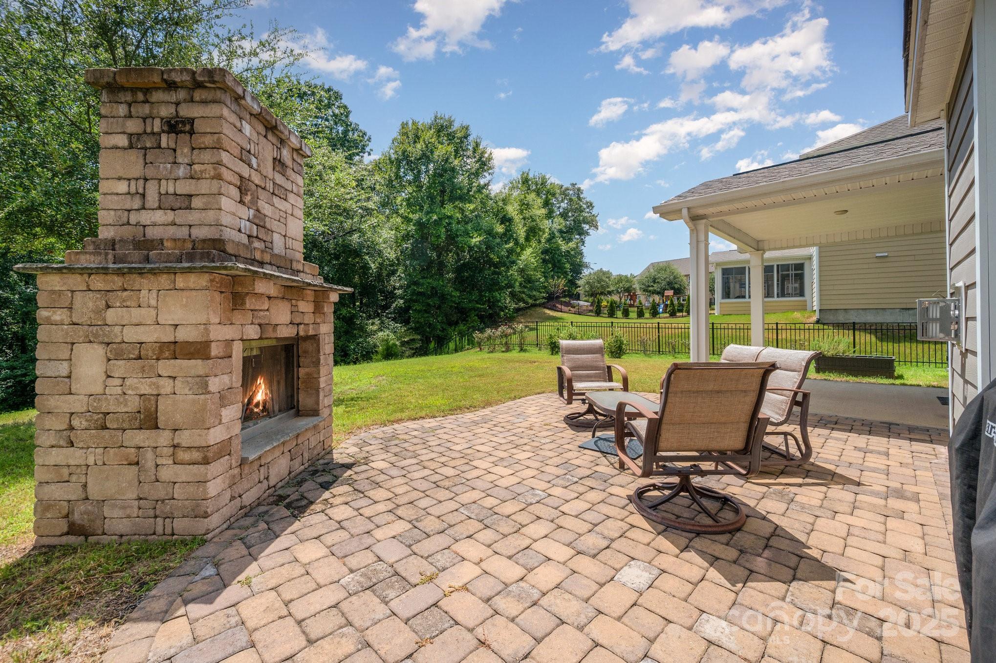 819 Coralbell Way Tega Cay, SC 29708 - Photo 25 of 33 a view of a patio with table and chairs with wooden floor and fence