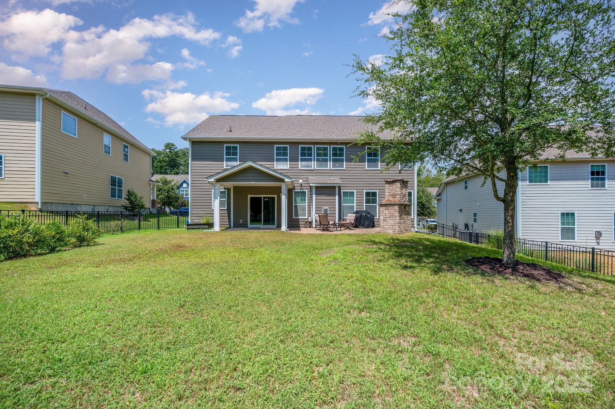 819 Coralbell Way Tega Cay, SC 29708 - Photo 28 of 33 a front view of a house with a yard