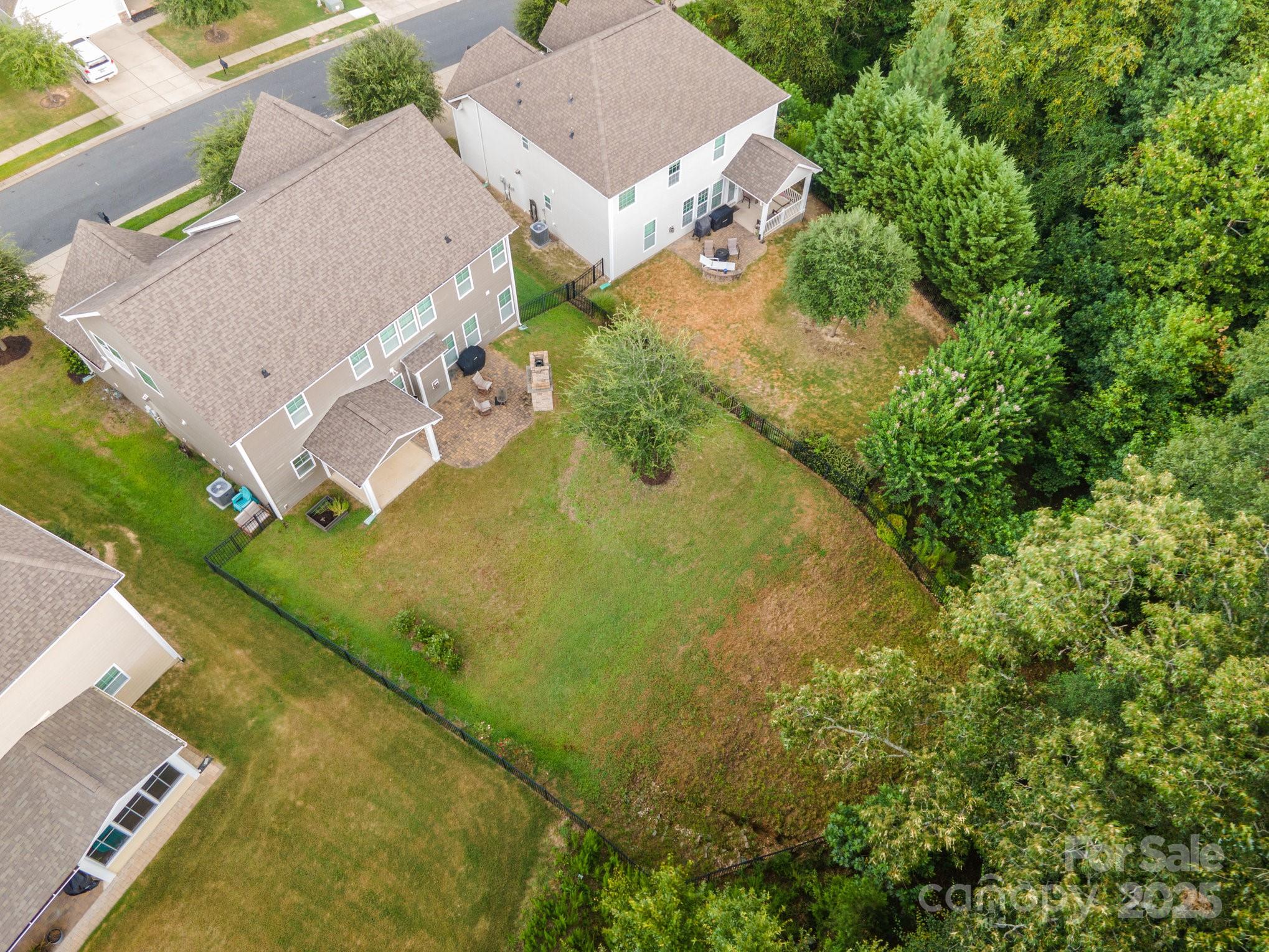 819 Coralbell Way Tega Cay, SC 29708 - Photo 29 of 33 an aerial view of residential house with outdoor space and trees all around