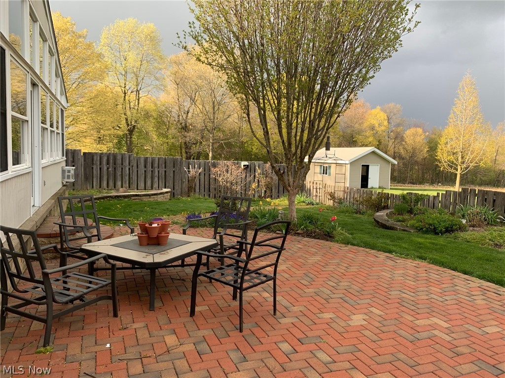 7892 Doylestown Road Sterling, OH 44276 - Photo 33 of 35 Large Brick patio in cozy, fenced back yard