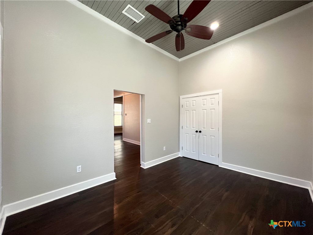 111 North 5th Street Temple, TX 76501 - Photo 11 of 19 an empty room with wooden floor and windows