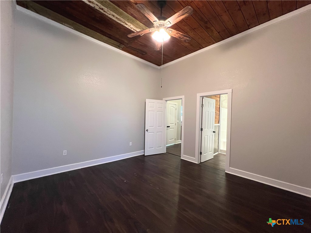 111 North 5th Street Temple, TX 76501 - Photo 16 of 19 a view of an empty room with wooden floor