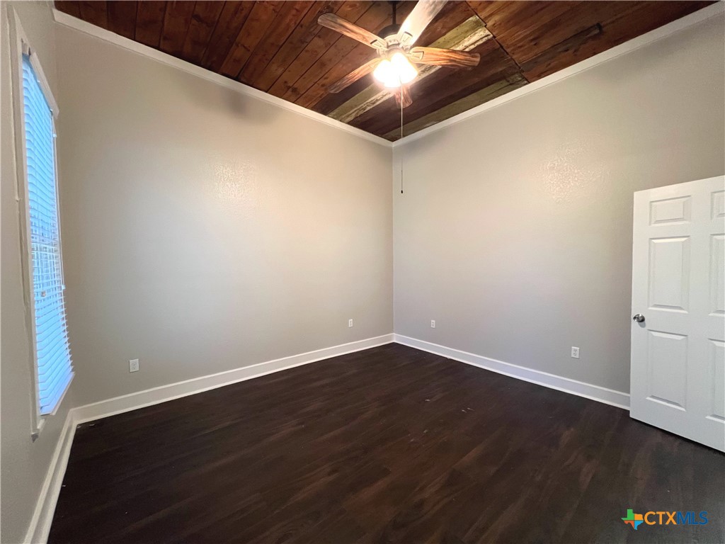 111 North 5th Street Temple, TX 76501 - Photo 17 of 19 a view of an empty room with wooden floor