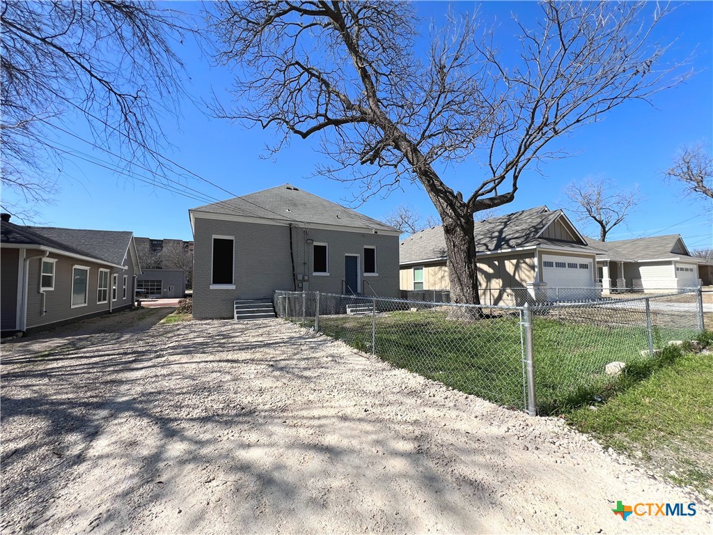 111 North 5th Street Temple, TX 76501 - Photo 19 of 19 a front view of a house with a yard