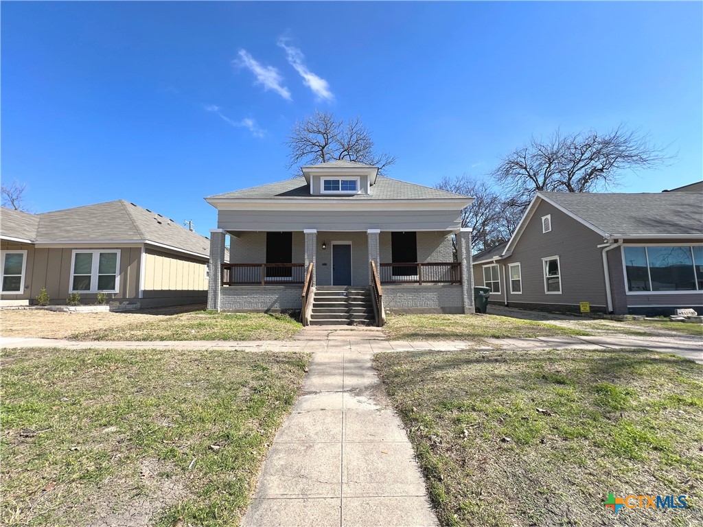 111 North 5th Street Temple, TX 76501 - Photo 2 of 19 a front view of a house with a yard