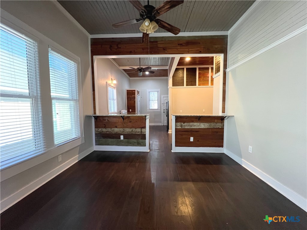 111 North 5th Street Temple, TX 76501 - Photo 6 of 19 a view of a hallway with wooden floor and a chandelier