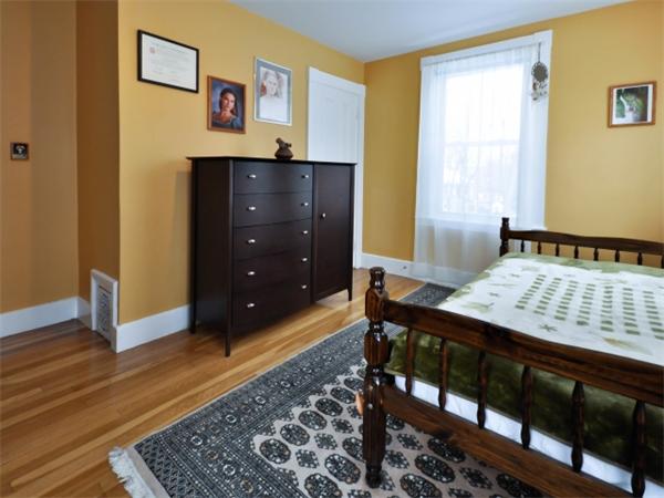 239 Walnut Street, Unit 239 Wellesley, MA 02481 - Photo 13 of 19 a view of a bedroom with furniture and window