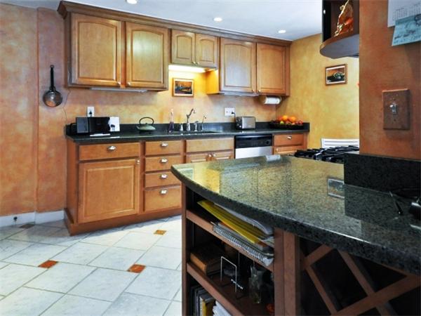 239 Walnut Street, Unit 239 Wellesley, MA 02481 - Photo 3 of 19 a kitchen with stainless steel appliances granite countertop a sink stove and cabinets