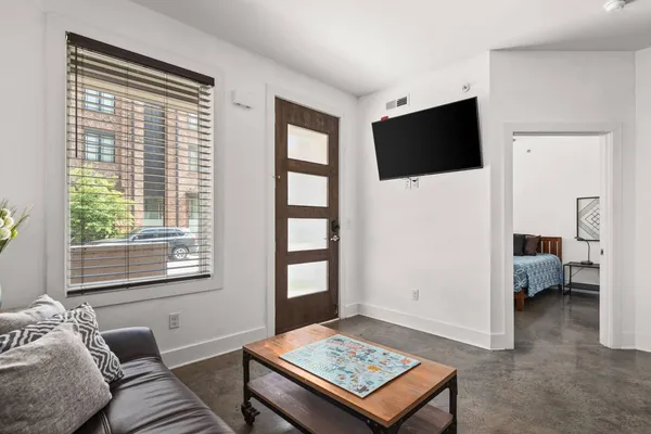 a living room with furniture and a window