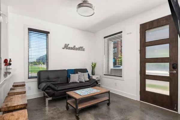 a living room with furniture and a window