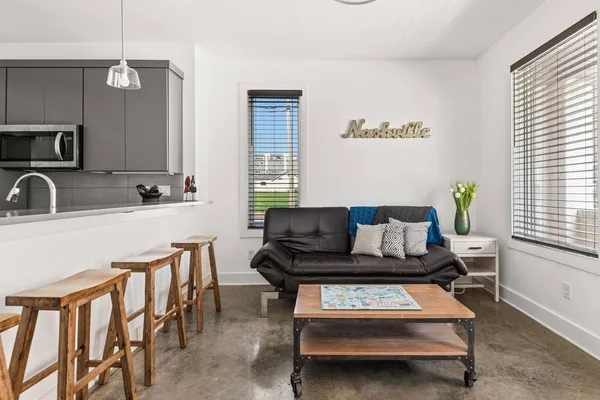 a living room with furniture and a window