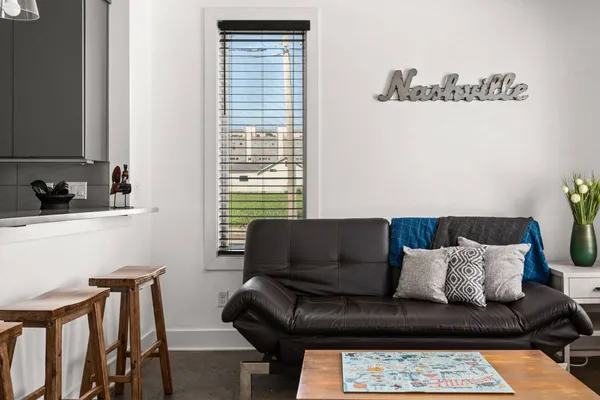 a living room with furniture and a window
