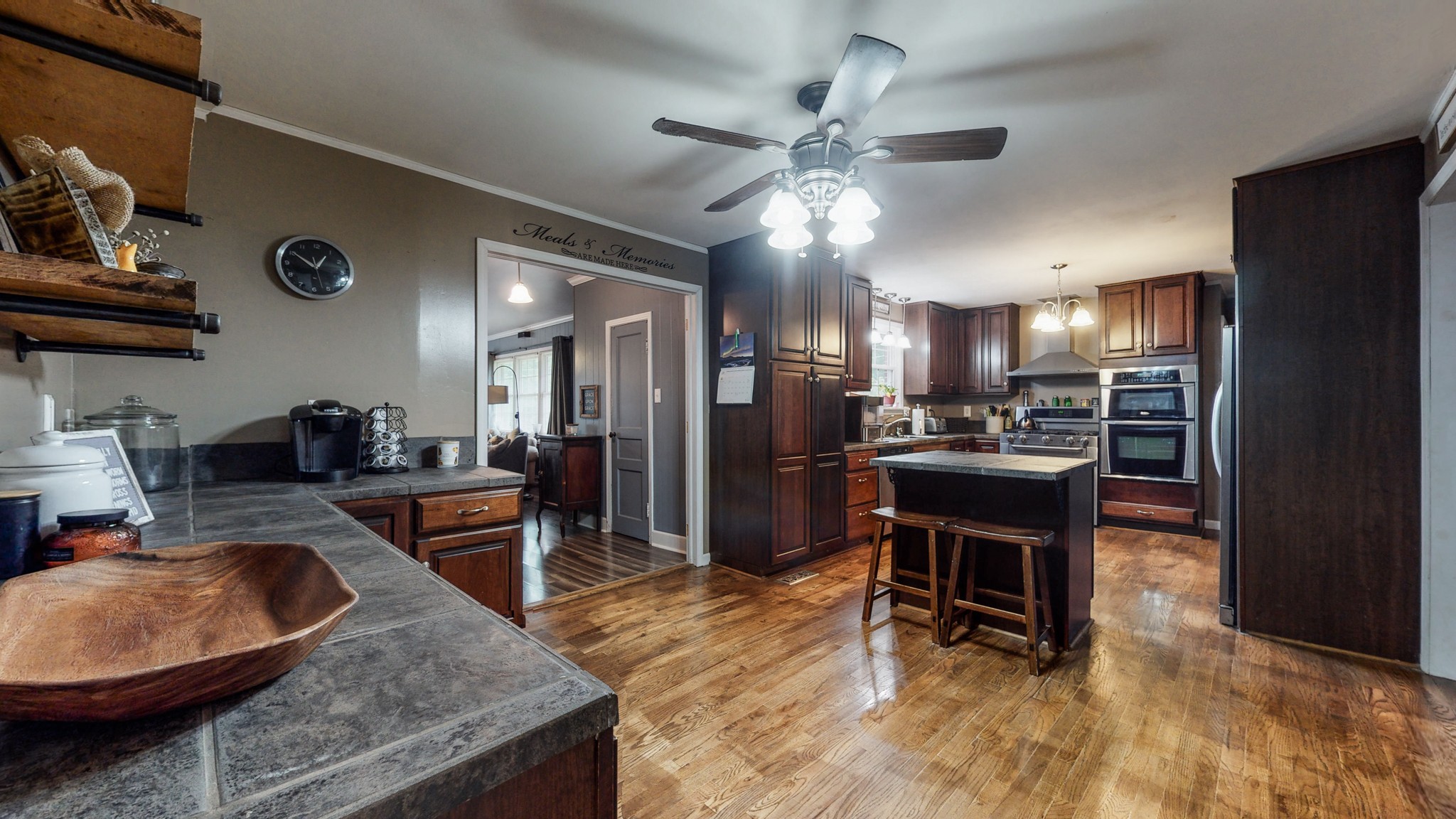 2101 Pea Ridge Road Clarksville, TN 37040 - Photo 17 of 59 a kitchen with stainless steel appliances granite countertop a sink a stove a dining table and chairs
