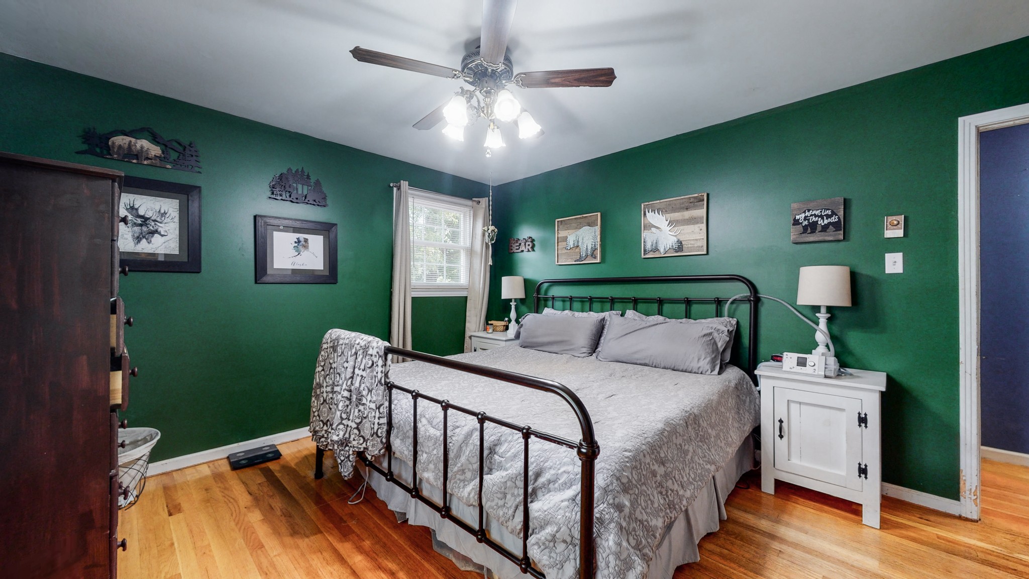 2101 Pea Ridge Road Clarksville, TN 37040 - Photo 25 of 59 a bedroom with a bed and a chandelier