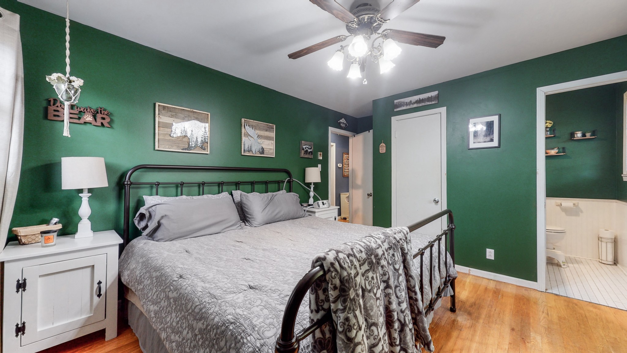 2101 Pea Ridge Road Clarksville, TN 37040 - Photo 26 of 59 a bedroom with a bed and a chandelier