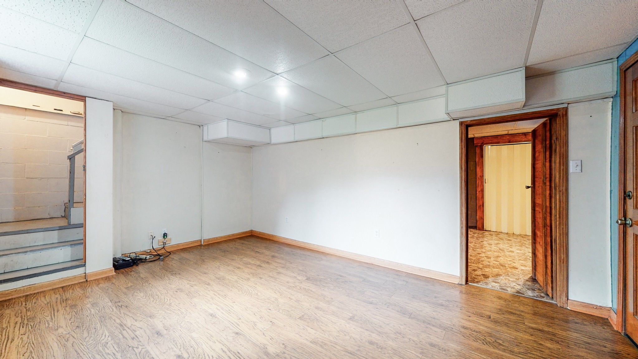 2101 Pea Ridge Road Clarksville, TN 37040 - Photo 35 of 59 an empty room with wooden floor and door