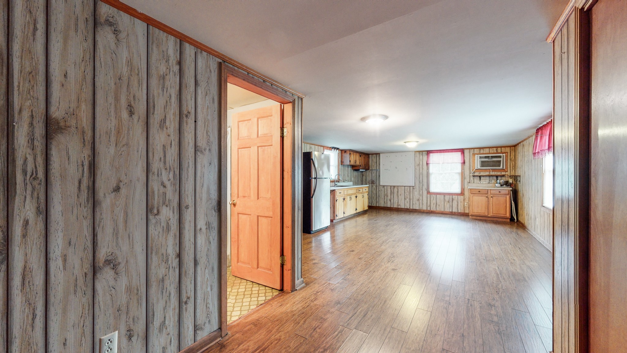 2101 Pea Ridge Road Clarksville, TN 37040 - Photo 40 of 59 a view of a hallway with wooden floor and windows