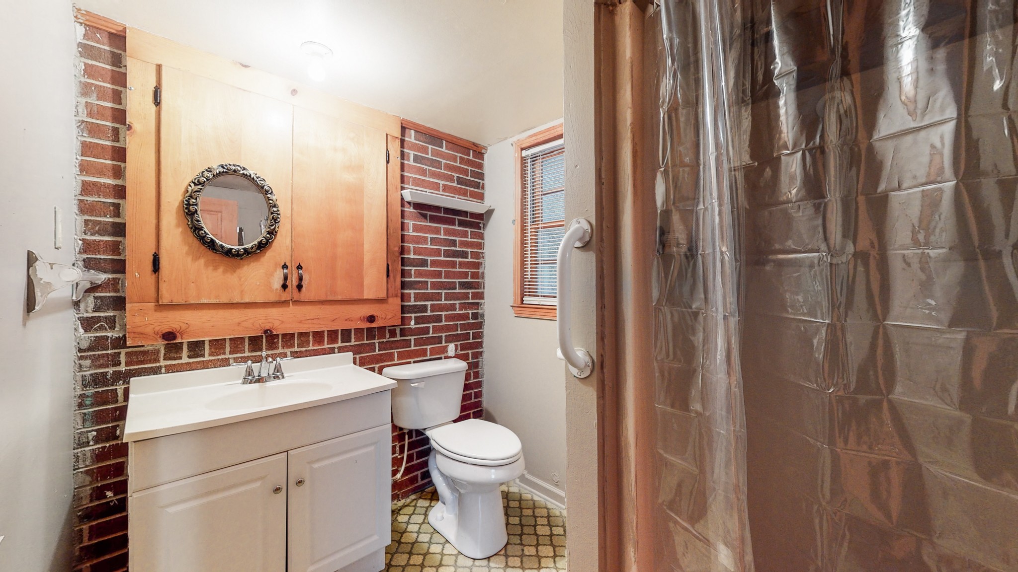 2101 Pea Ridge Road Clarksville, TN 37040 - Photo 44 of 59 a bathroom with a toilet a sink and a mirror