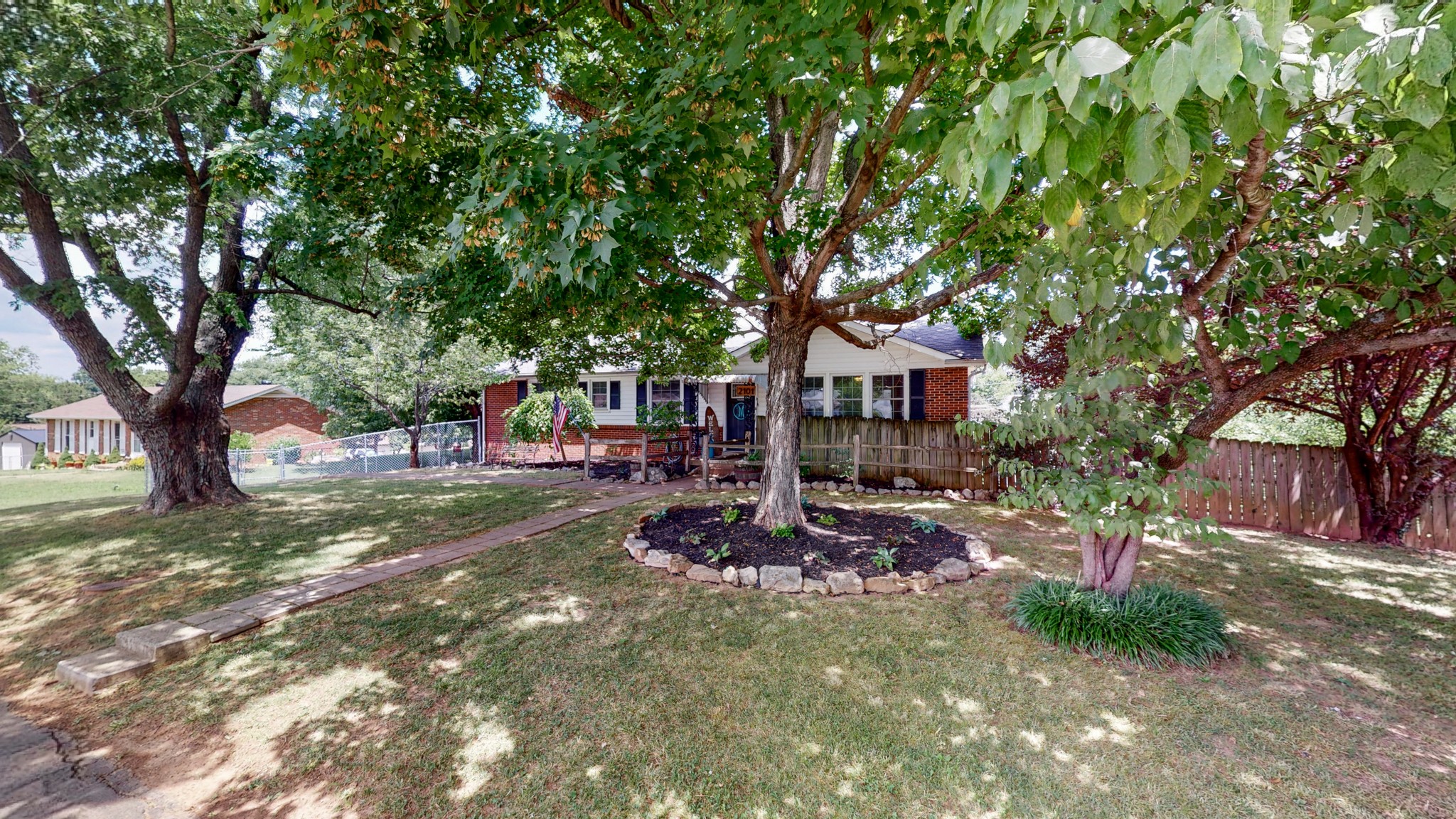 2101 Pea Ridge Road Clarksville, TN 37040 - Photo 48 of 59 a view of a patio with table and chairs with wooden fence and large trees