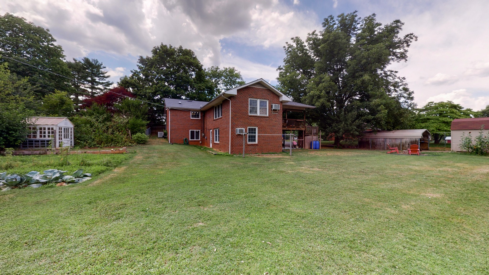2101 Pea Ridge Road Clarksville, TN 37040 - Photo 52 of 59 a front view of a house with a garden and trees