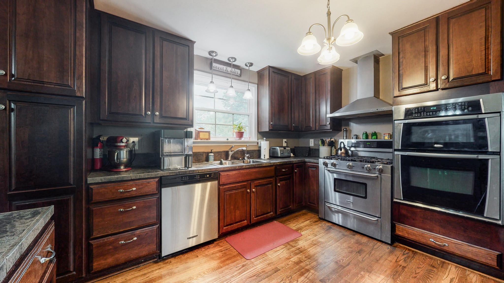 2101 Pea Ridge Road Clarksville, TN 37040 - Photo 8 of 59 a kitchen with granite countertop wooden cabinets stainless steel appliances and a window