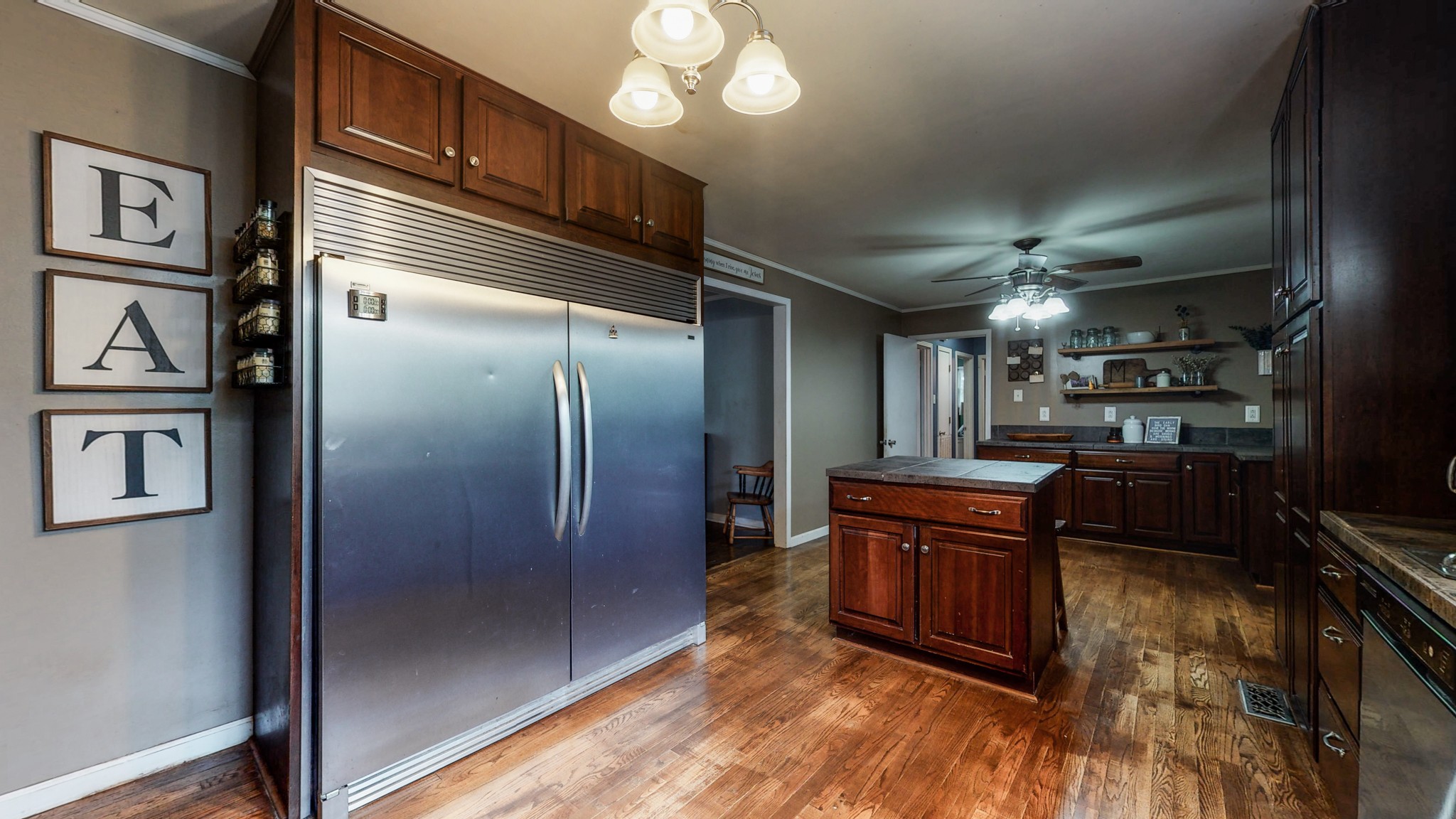 2101 Pea Ridge Road Clarksville, TN 37040 - Photo 10 of 59 a kitchen with stainless steel appliances granite countertop a refrigerator a stove and a sink with wooden floor