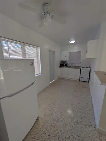 a view of kitchen with furniture and wooden floor