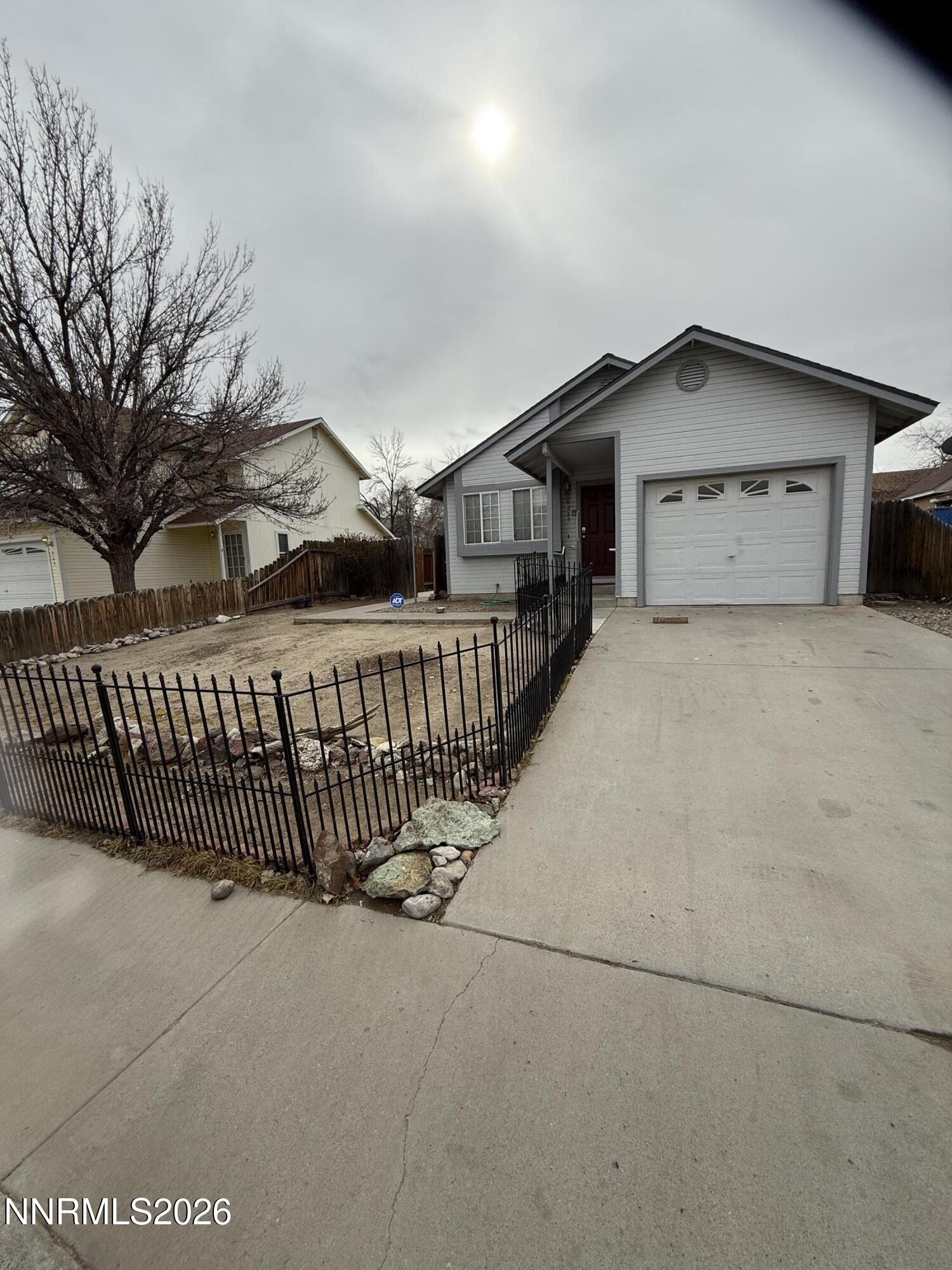 285 Amanda Lane Fallon, NV 89406 - Photo 2 of 15 a view of a house with a yard and wooden fence