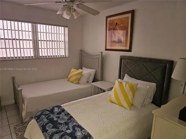 a bedroom with a bed and a lamp