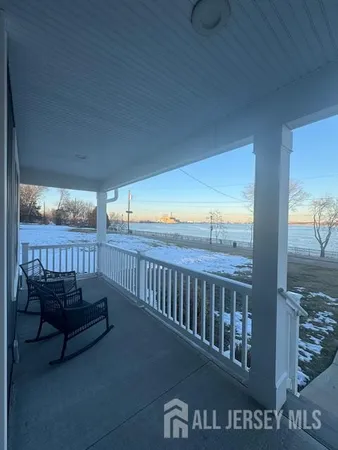a view of a balcony with furniture