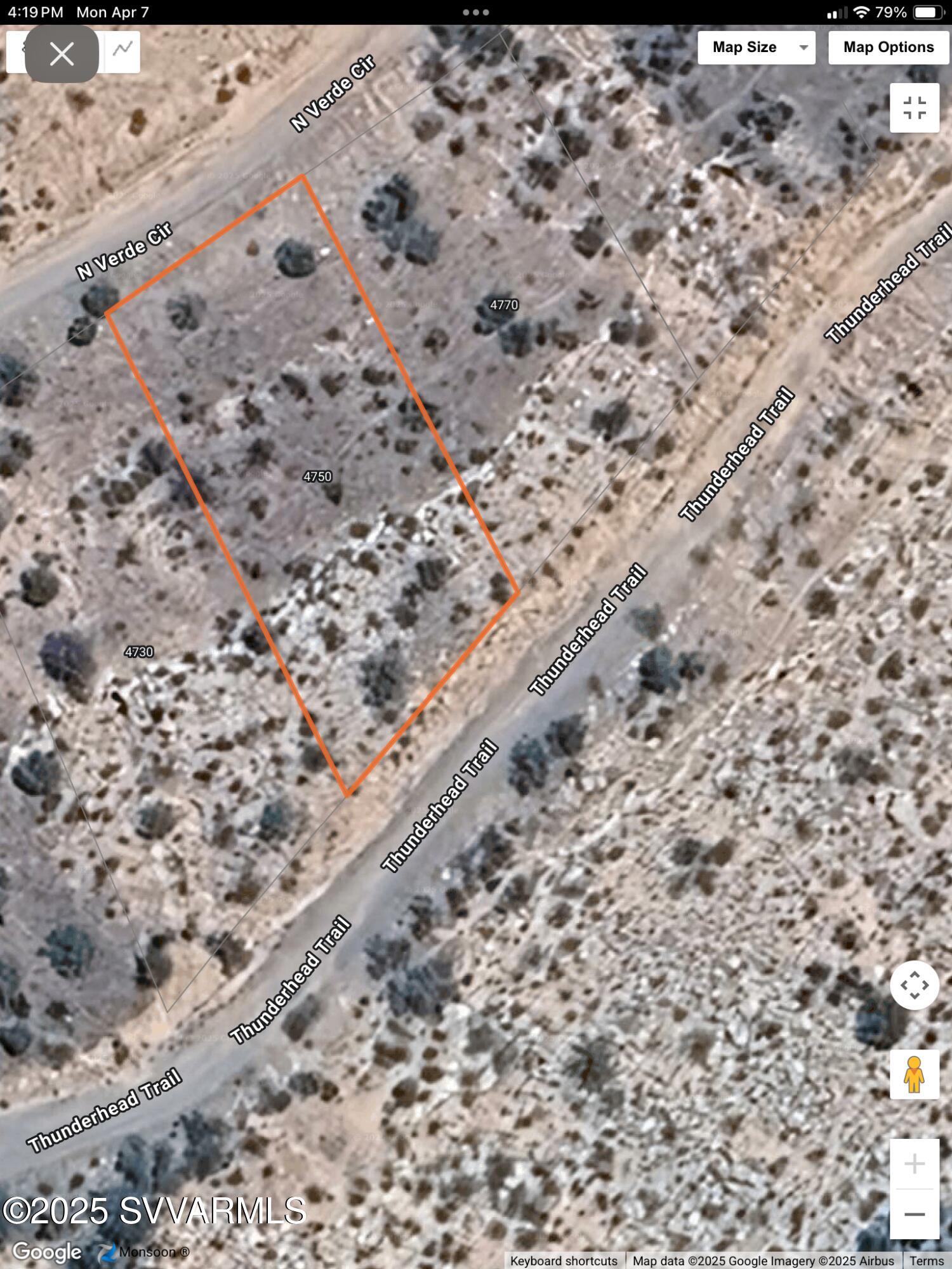 4750 Thunderhead Trail, Unit 227 Rimrock, AZ 86335 - Photo 22 of 23 a large stone wall with a large tree covered with wooden fence