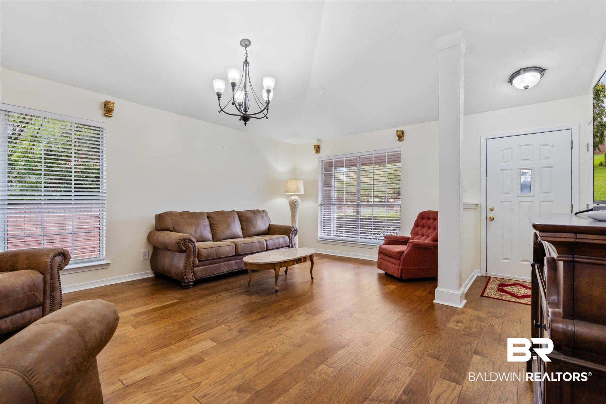 7236 Highpointe Place East Daphne, AL 36527 - Photo 2 of 32 Living room with light hardwood / wood-style floors and a notable chandelier