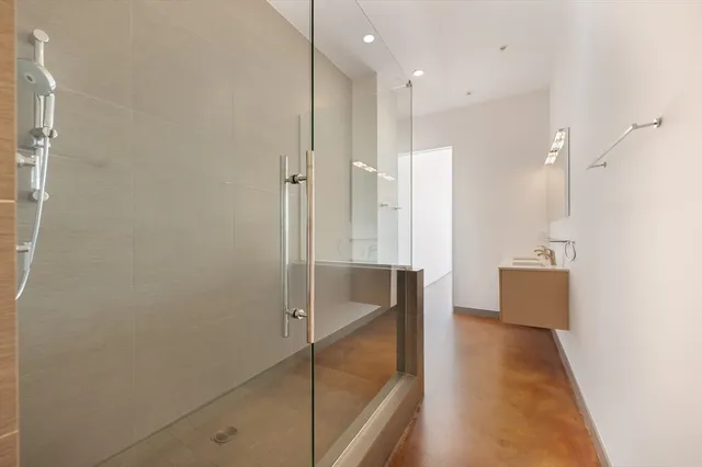 a bathroom with a shower and a tub