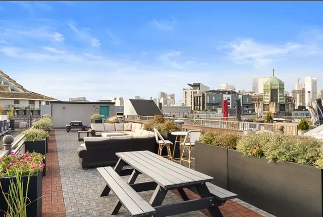 a view of a terrace with furniture and stove