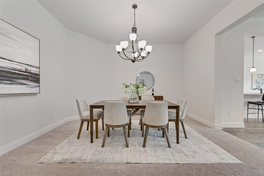 704 Toby Trail Mansfield, TX 76063 - Photo 12 of 40 Dining area featuring a chandelier and light carpet