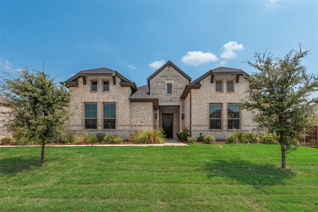 704 Toby Trail Mansfield, TX 76063 - Photo 2 of 40 French provincial home with brick siding and a front yard