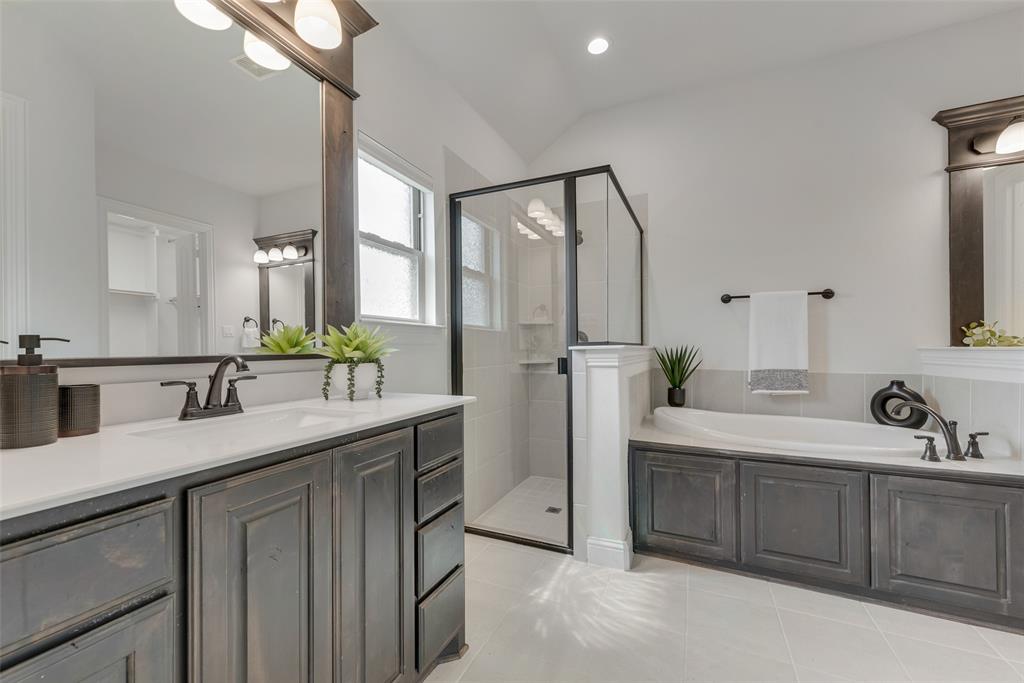 704 Toby Trail Mansfield, TX 76063 - Photo 27 of 40 Bathroom featuring a stall shower, a bath, vanity, light tile patterned floors, and recessed lighting