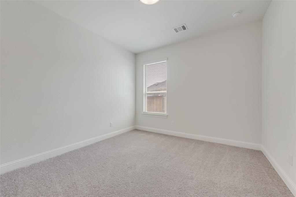 704 Toby Trail Mansfield, TX 76063 - Photo 33 of 40 Unfurnished room with light carpet and baseboards