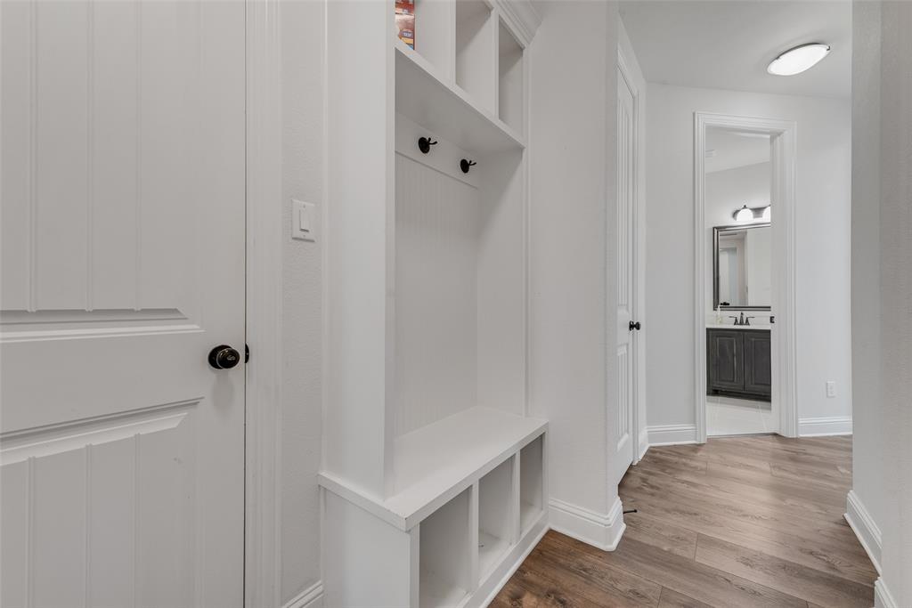 704 Toby Trail Mansfield, TX 76063 - Photo 34 of 40 Mudroom with wood finished floors and baseboards